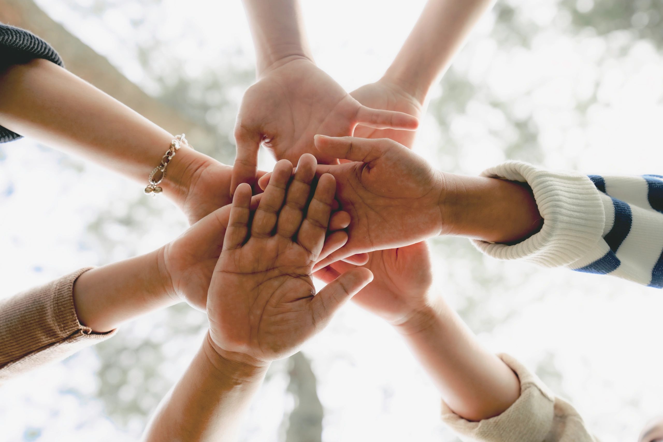 Hands joined together in mutual support
