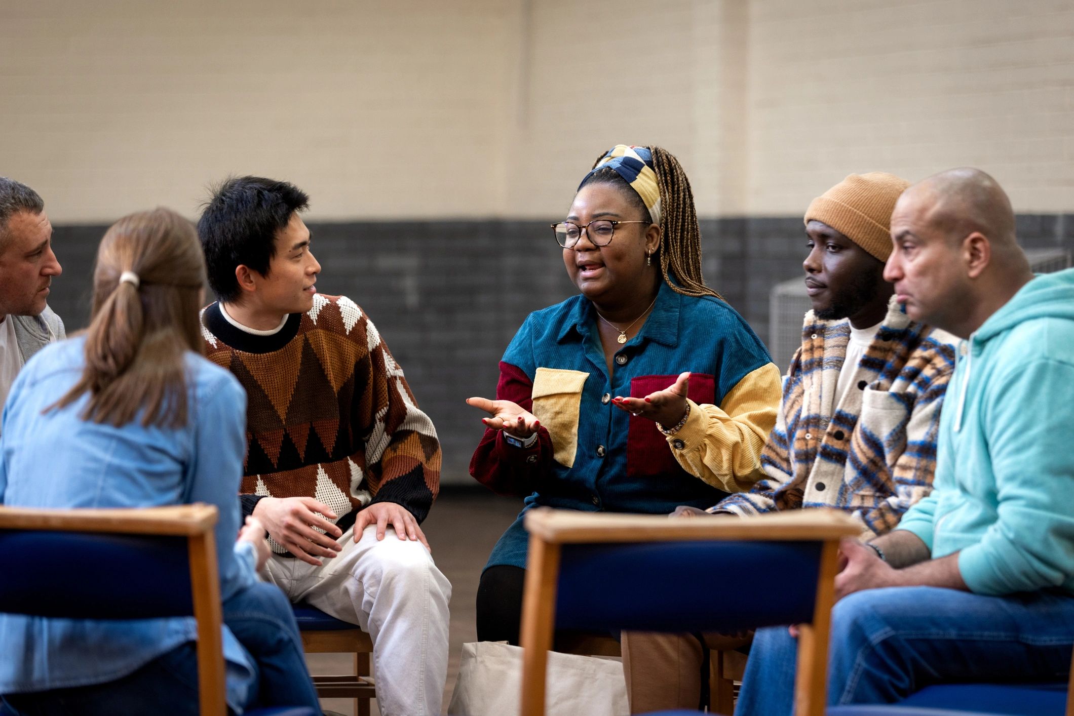 Community group gathered together in conversation