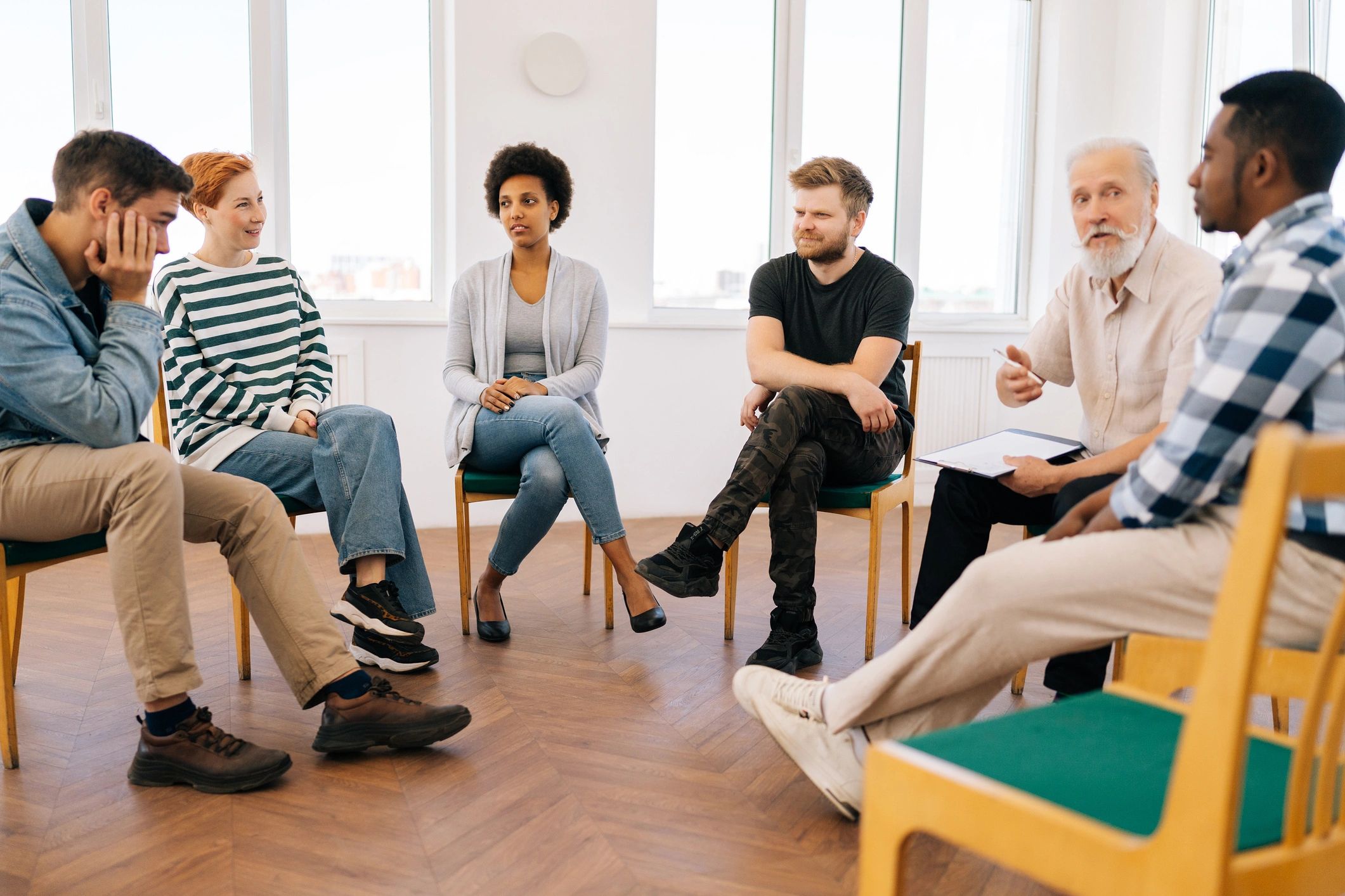 Adults seated in a group learning environment
