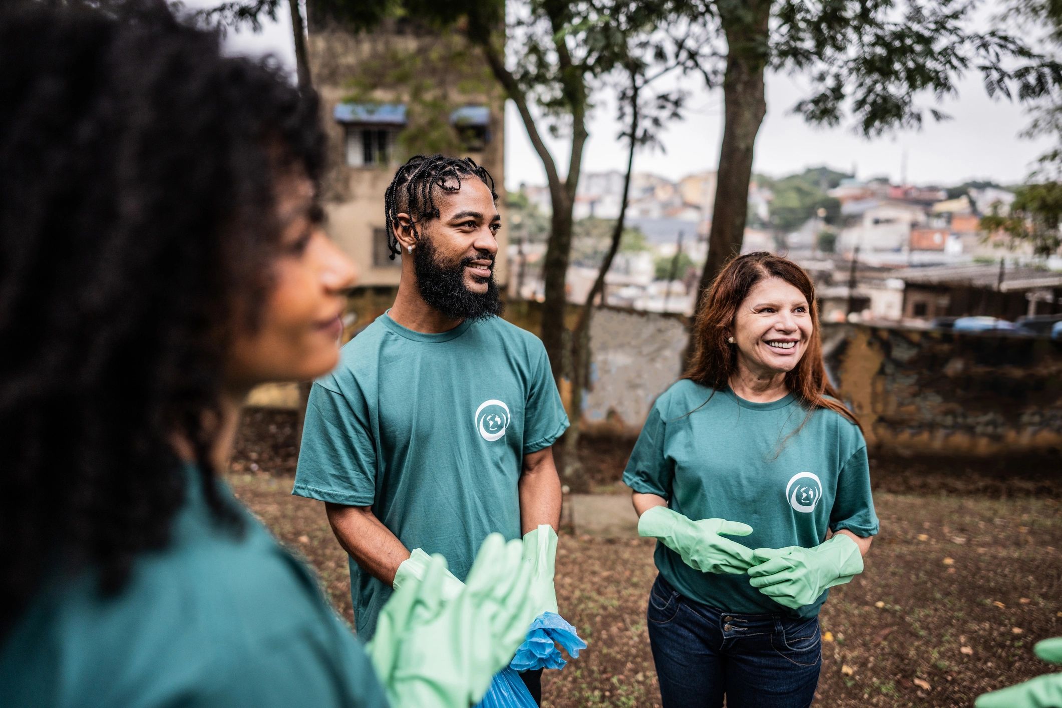 Volunteers and community members talking together outdoors