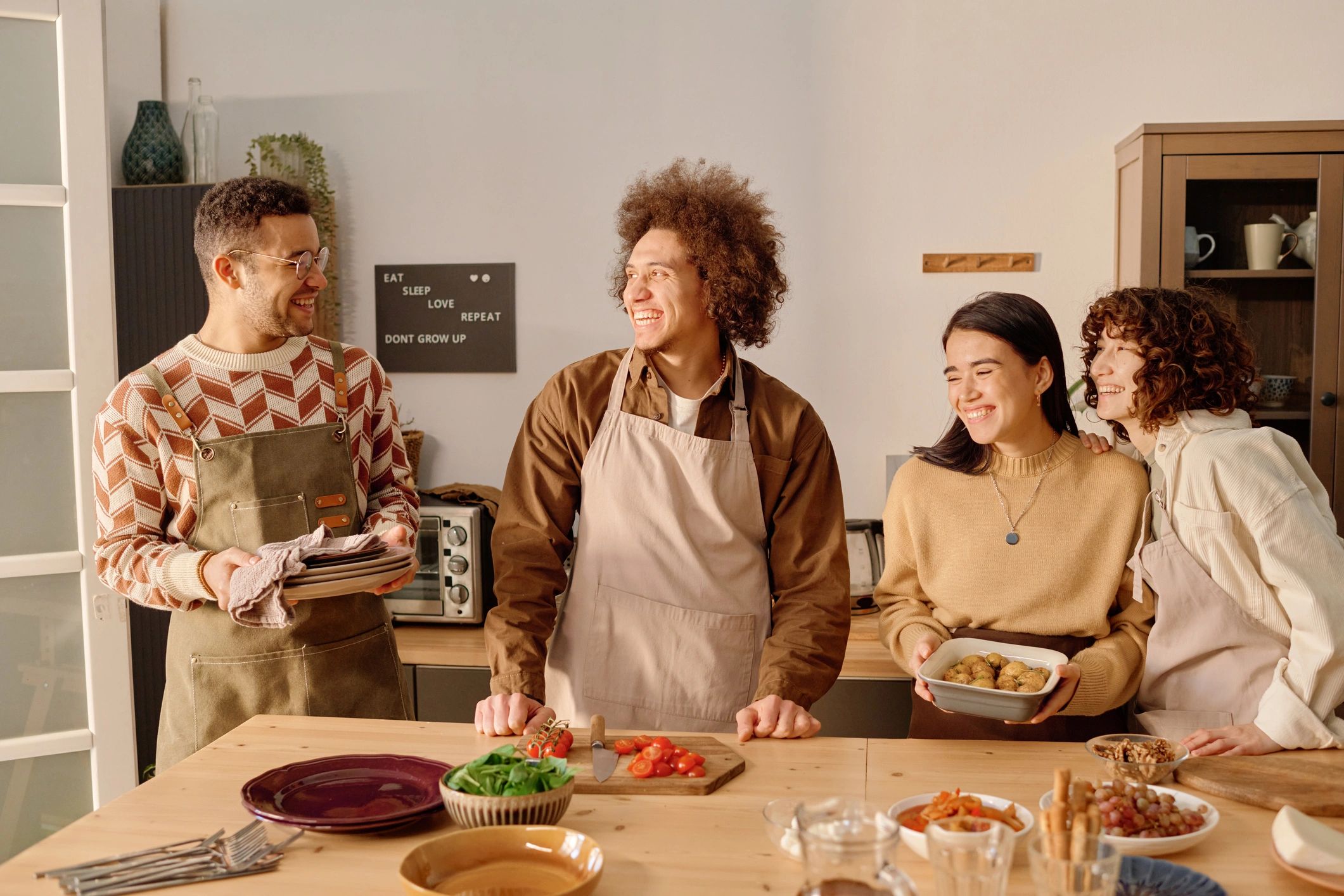 Volunteers gathered around a table serving food together
