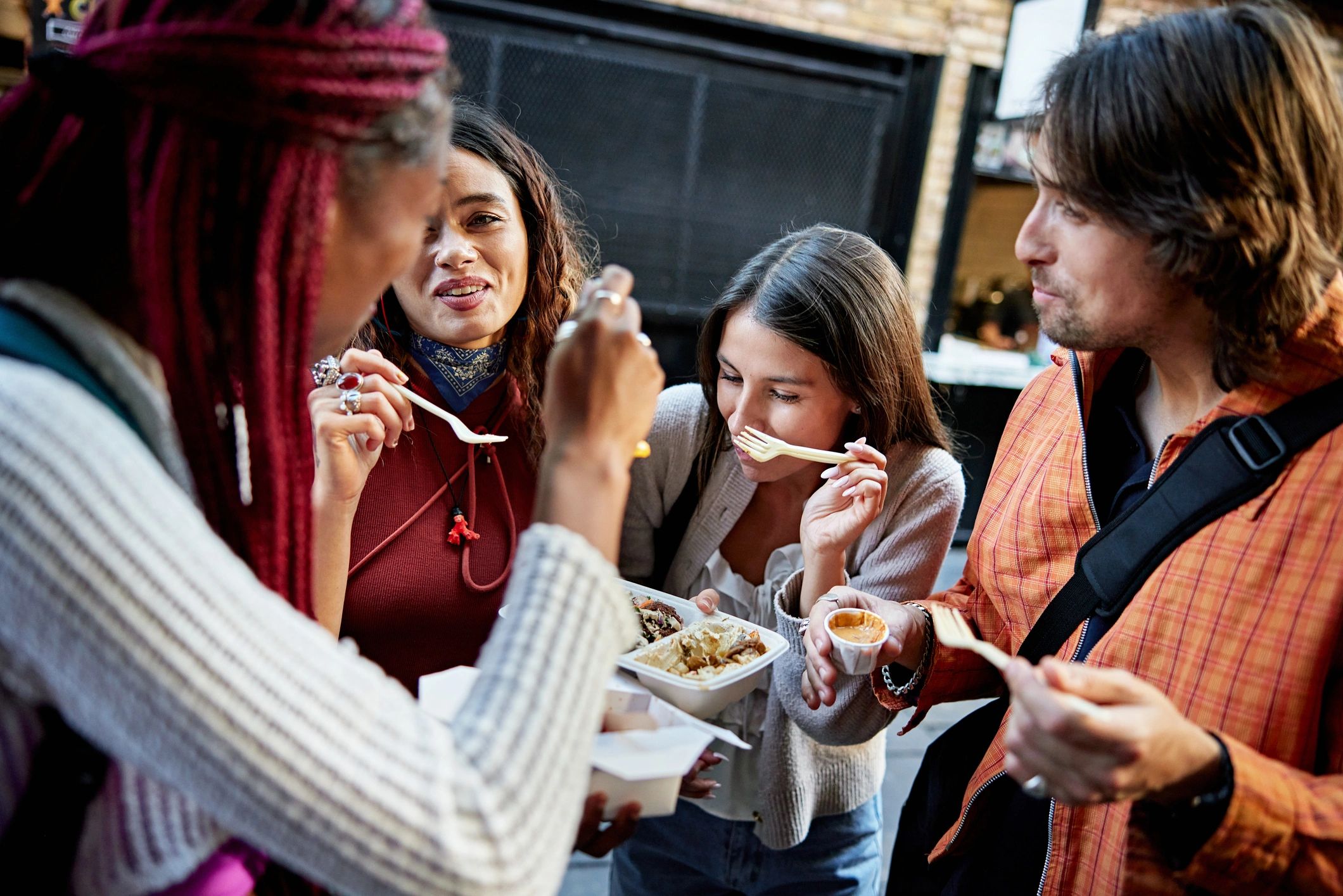 Community members enjoying food together outdoors