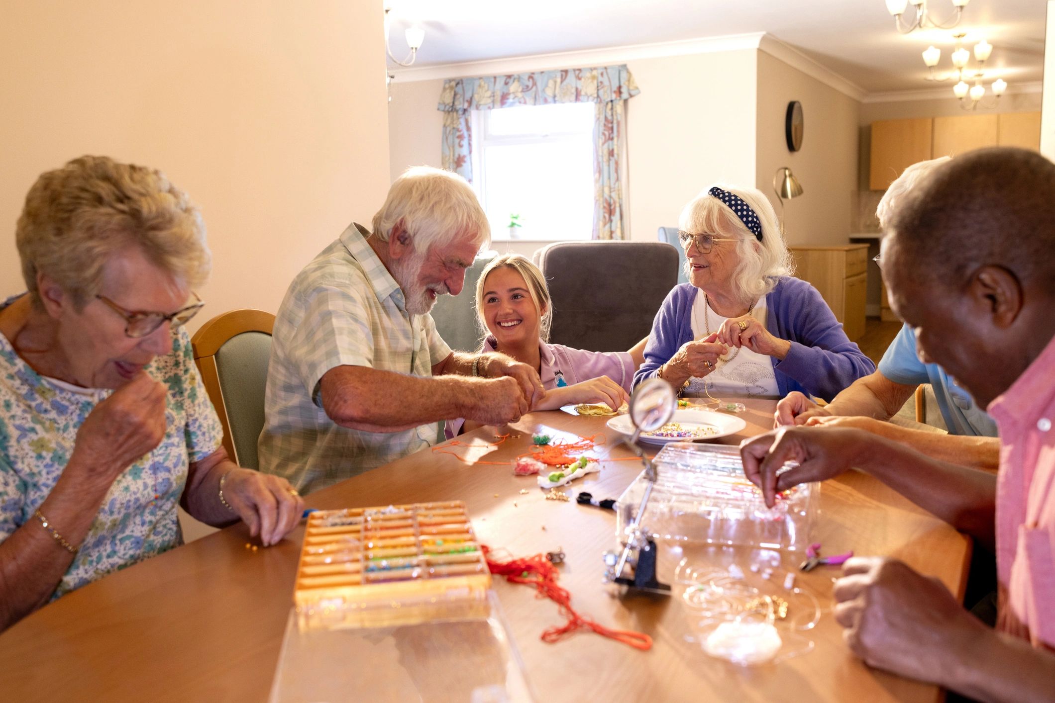 Community workshop session with adults gathered around a table